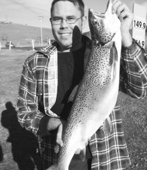 Alex McAdam with a 4.6kg Atlantic salmon caught trolling in the shallows just off the Claypits with a brown trout jointed Rapala minnow